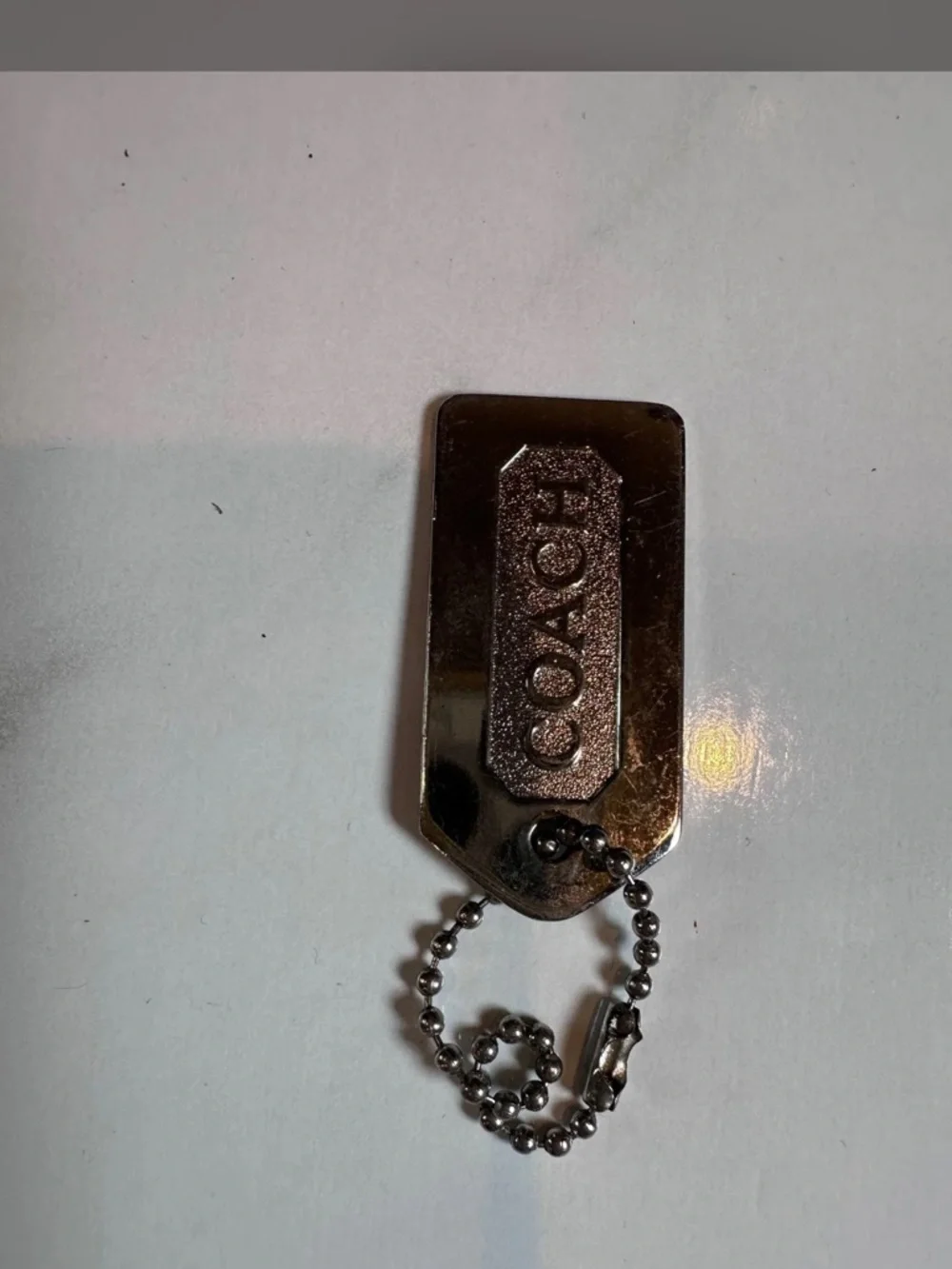 Coach Gold-Tone Logo Dog Tag Keychain
